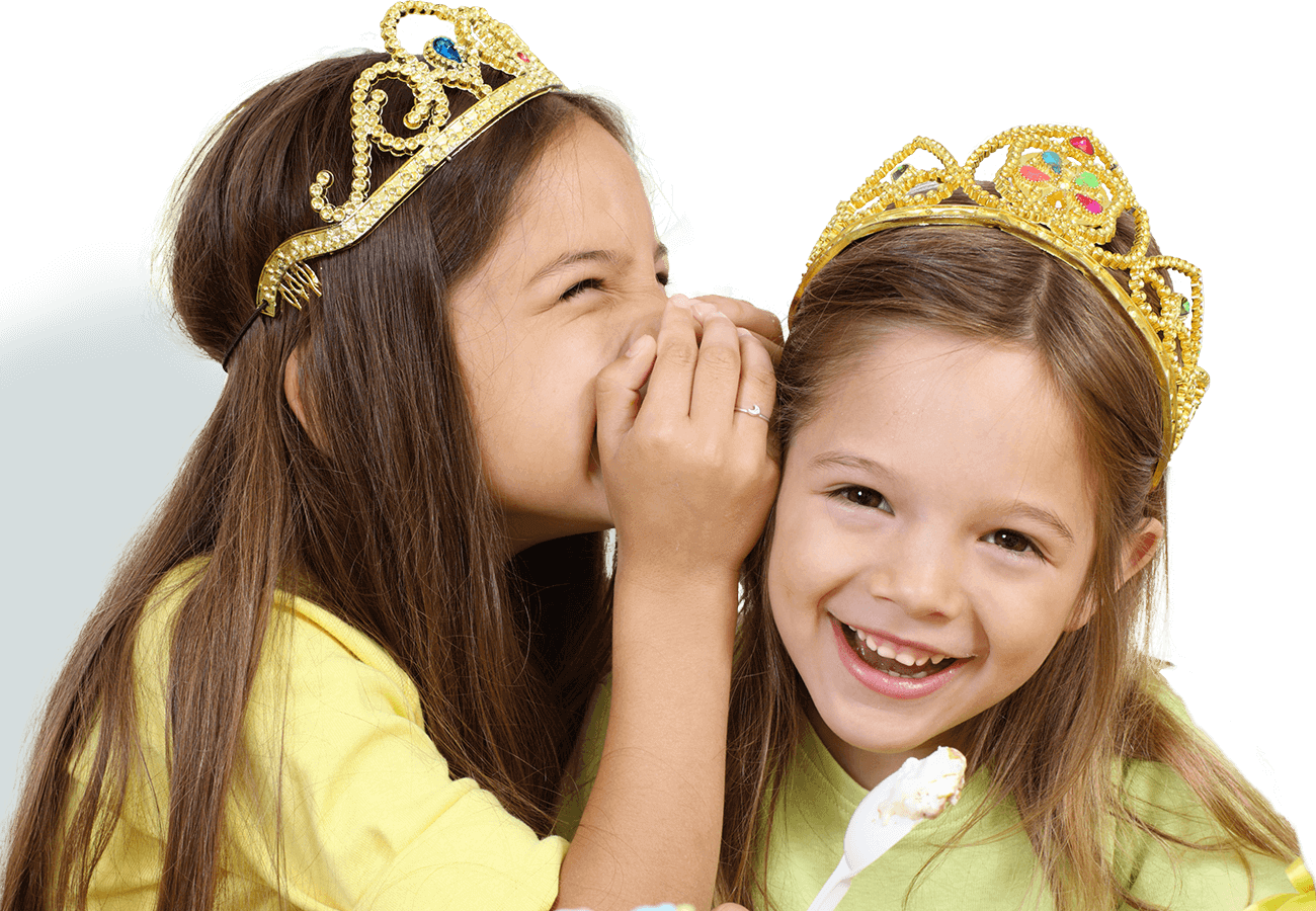 kids klubs gallery page banner photo of two girls dress as princesses, one whispering in the others ear